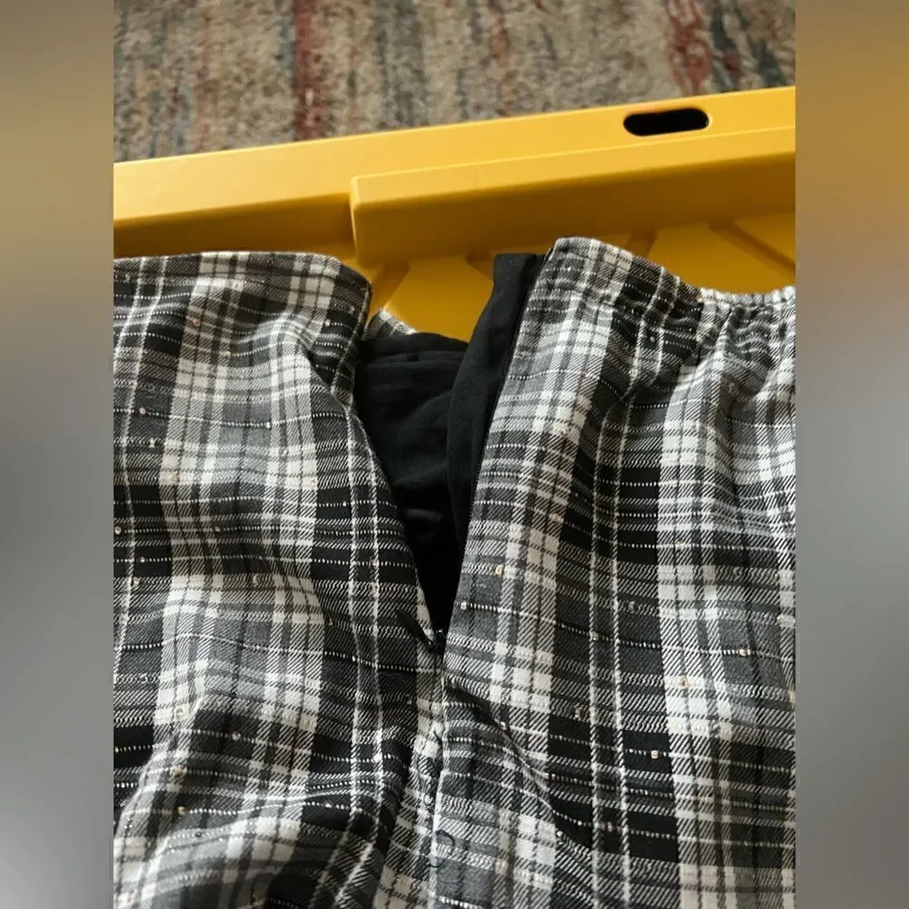 Kidpik Plaid Skirt with attached shorts and bow detail; zipper closure